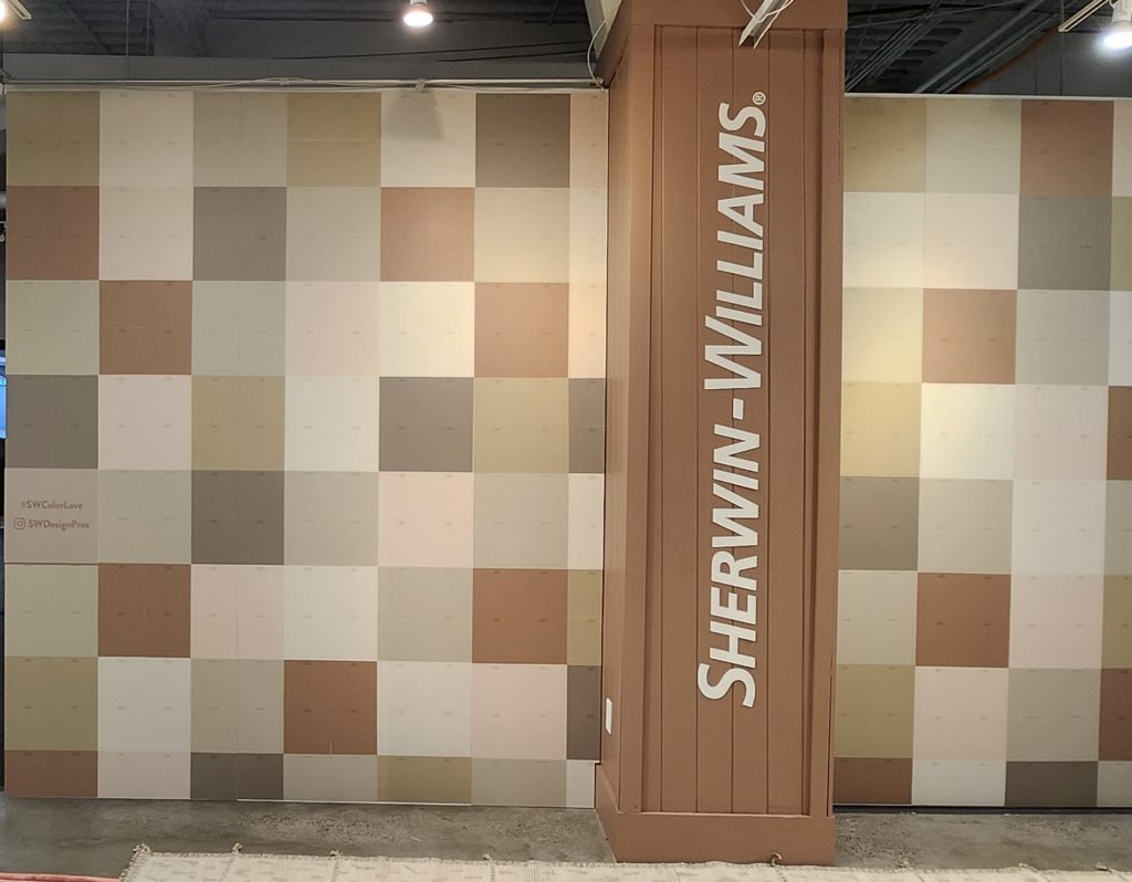 A showroom wall with a mosaic of Sherwin-Williams colors
